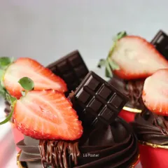 A detailed shot of the chocolate strawberry cupcakes, highlighting the rich chocolate frosting and glossy fruit.