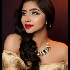 A close-up that highlights the winged eyeliner and bold red lip, perfect for a makeup artist's portfolio.