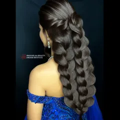 It's all in the details. Our hairdressing course teaches students how to create complex, elegant styles like this multi-strand pull-through braid, perfect for weddings and grand occasions.