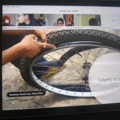 An instructor points out the different layers of a bicycle tire during a live online session. Our virtual workshops are just as hands on, with clear demonstrations that guide participants through each step.