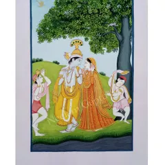 A Pahari miniature painting showing the divine love of Radha and Krishna. I create these pieces using traditional methods and natural earth colours on paper, focusing on the delicate expressions and details that define the Guler style of art.