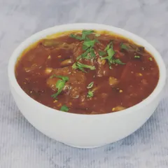 A bowl of my Veg Manchurian gravy. These vegetable balls are fried until crisp and then tossed in a sweet and tangy sauce, making for a perfect appetizer or main course.