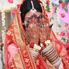 Capturing the beautiful moments of a bride on her wedding day is a joy. Her intricate henna, with its deep, dark stain, is the perfect accessory for her stunning bridal look.