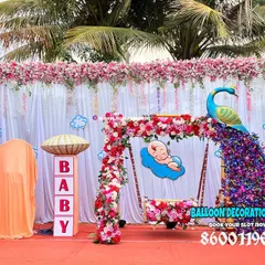 For a grand and traditional naming ceremony, I created this stunning outdoor setup featuring a floral peacock and a beautifully decorated baby jhula (cradle). The design combines vibrant colors with classic cultural elements for a truly royal feel.