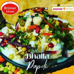 My special Bhalla Papdi is a delightful mix of textures and tastes. It features soft lentil fritters (bhalla) and crispy wafers (papdi) topped with yogurt, chutneys, and spices.