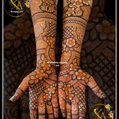 This intricate floral design covers the hands and arms in a dense pattern of flowers and leaves. The combination of bold florals and fine-line details creates a rich and luxurious effect.