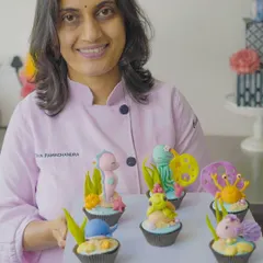 Holding a tray of finished cupcake toppers from one of my workshops! I love seeing the amazing creations my students make. My classes are designed to be friendly and relaxed, perfect for anyone wanting to learn.