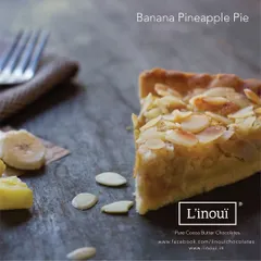 A unique creation from our kitchen, the Banana Pineapple Pie. This experimental pie combines the sweetness of banana and the tang of pineapple in a buttery crust, topped with toasted almonds.