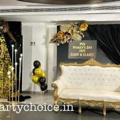 We create stylish photo opportunities that become a highlight of any event. This photo booth for a Women's Day celebration features a shimmering gold sequin wall, elegant black draping, and a vintage-style sofa, perfect for guest photos.