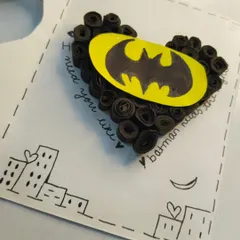 A closer look at the details on the Batman card, including the hand-drawn Gotham cityscape and the heartfelt, handwritten message.