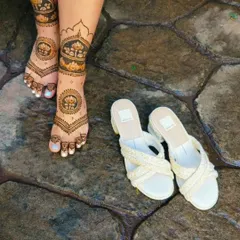 A stunning lotus-themed design for the feet. The pattern covers the top of the foot and extends up the leg, creating a look that is perfect for a bride or for showing off with a pair of nice sandals.