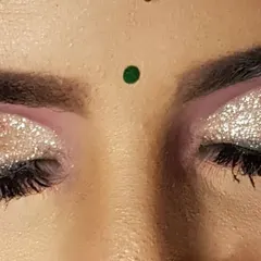 A full glitter cut crease eye makeup. I used a silver glitter over a soft purple base to create this high-impact, glamorous look for a bride's reception.