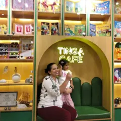 A mother and daughter enjoy a happy moment together in our brightly lit Tinga Cafe.