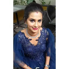 A perfect party look for a client celebrating her son's birthday. The focus is on a blue-toned smokey eye to match her gown, paired with a fresh, glowing complexion and a simple updo.