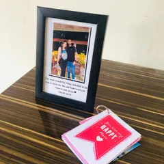 A perfect little combo gift. This set includes a framed photo with a custom message and a mini tag album filled with more of your favorite pictures.