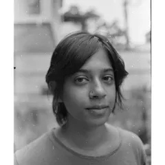 A simple, direct portrait shot on film. The beauty of analog is in its imperfections, the dust and scratches that remind you it's a physical object made by hand.