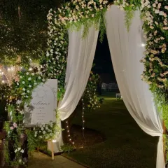A romantic garden entrance for an outdoor wedding. I created a beautiful archway of white and pink florals, with a personalized welcome sign to greet the guests as they arrive.