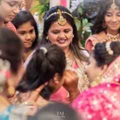 A candid moment of the bride sharing a final word with her family during the farewell ceremony. It's the small interactions that hold so much meaning.