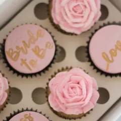 A close-up of my hand-painted and piped floral cupcakes for a bridal shower. I enjoy combining different techniques to make each set unique. Do you prefer the painted words or the piped buttercream flowers?
