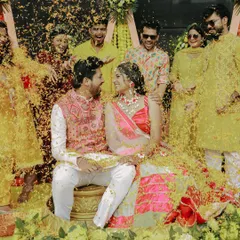 The beautiful chaos of Haldi. Surrounded by the laughter of friends and a storm of yellow petals, this is pure, unadulterated joy. I capture the energy and color of these traditions, preserving the fun that makes your story unique.