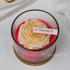 A single peony candle in a glass jar, perfect for adding a pop of color and a delicate floral scent to your favorite nook.