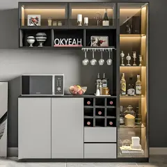 A multifunctional unit for a dining area, this piece includes a bar, crockery storage, and a spot for a microwave. The combination of open wine racks, glass-door cabinets, and closed storage makes it highly versatile.