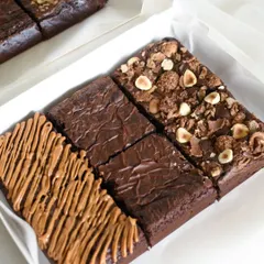 My assorted eggless brownie box is a crowd-pleaser, featuring a trio of my most-loved flavors: rich Double Chocolate Chip, gooey Biscoff, and indulgent Nutella Ferrero Rocher. It's the perfect box for gifting or treating yourself.