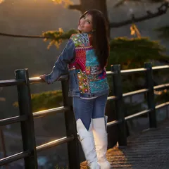 Taking fusion style on the road. I styled this denim jacket, which features a colorful ethnic patchwork back, with simple jeans and statement white boots for a cool and comfortable travel look.