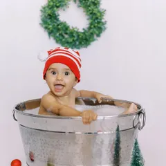 A big, happy smile from the tub. This Christmas-themed splash session was a fun and festive way to end our shoot.