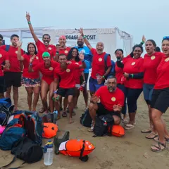 This is our adult squad, the Jellies, celebrating after a race. We're a tight-knit group of triathletes, open-water lovers, and Masters swimmers who train hard and have a lot of fun doing it.
