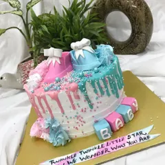 A closer look at the "Twinkle Twinkle Little Star" baby shower cake, showing the delicate details of the fondant booties and baby blocks.