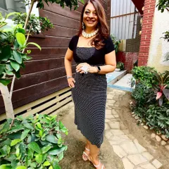 A peek at my clearance sale prices. This polka dot dress is now just 999, and the pearl necklace is only 499. Come visit and find amazing deals on western wear, sarees, fabrics, and jewellery.
