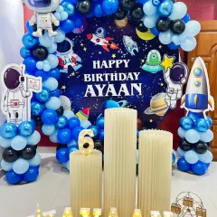 A complete astronaut and rocket theme for Ayaan's 6th birthday, featuring multiple cutouts and a starry night backdrop.