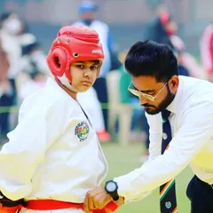 A crucial moment of focus before a match. I always provide personal guidance to my students to ensure they are mentally and physically prepared for competition.