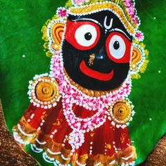 A brightly lit close-up of the finished Jagannath artwork. This angle highlights the fine details, from the delicate floral decorations in his crown to the shimmering gold accents on his clothing.