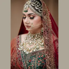 A stunning close-up bridal portrait of Rhea, showcasing her intricate jewelry and flawless makeup.