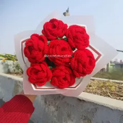 A classic bouquet of seven vibrant red crochet roses, perfect for expressing love and affection. Unlike real flowers, this romantic gesture will last a lifetime.