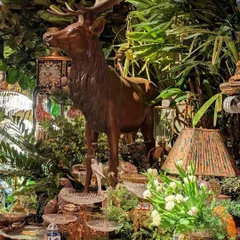 Another detail from the Sabyasachi event, where a majestic deer statue stands amidst a dense arrangement of plants. We used a variety of foliage to surround the decor pieces, making it feel as though guests were exploring a magical, antique-filled forest.