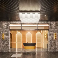 The entrance of a banquet hall sets the tone for every celebration. Here, we used grand arches, warm backlighting, and a striking reception desk to create a welcoming yet sophisticated entryway that promises an unforgettable event.