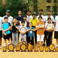 Our players and coaches with a massive haul of trophies from the Delhi/NCR Inter-School tournament. This shows the collective success and team spirit that defines our academy.