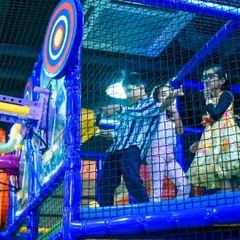 Kids aiming for the target with our air-powered soft ball cannons. This interactive game is a highlight of the My Maze area.