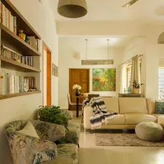 A view from the foyer into the main living area. We used existing furniture and added new pieces to create a comfortable and eclectic space that reflects the personality of the homeowners.