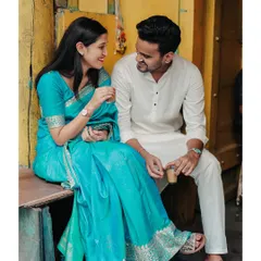 Sharing a cup of chai, this candid photo captures a simple, authentic moment of connection amidst the old-world charm of Mumbai.