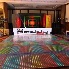 The complete setup for a cocktail night, featuring a full LED dance floor, a large video wall, and professional speakers. I ensure the entire production is top-notch for an insane party experience.