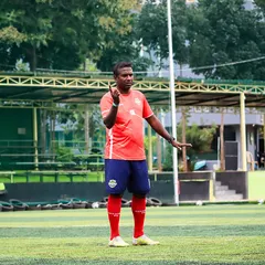A coach directs his players during a training session. Tactical instruction and clear communication are key components of our preparation for every match.