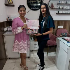 Presenting a certificate of completion to a talented student. Look at the variety of art she learned to create.