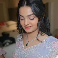 A candid moment showing the soft, ethereal quality of the makeup and hairstyle.