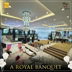 An elevated perspective of the Karjat banquet hall, showcasing its vast capacity and versatile layout. The combination of tiered sofa seating and traditional chairs allows for customized arrangements, perfect for weddings, receptions, and large corporate events.
