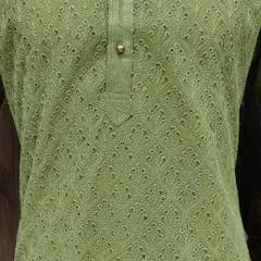 A beautiful olive green kurta with intricate Chikankari work. This is a unique and stylish color choice for a Mehndi function or other pre-wedding events.