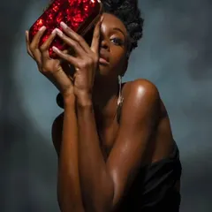 An editorial beauty shoot where the goal was to create a radiant, glass-skin effect. This high-fashion look highlights dewy skin and sculpted features, designed to catch the studio lights perfectly for a dramatic, impactful image.